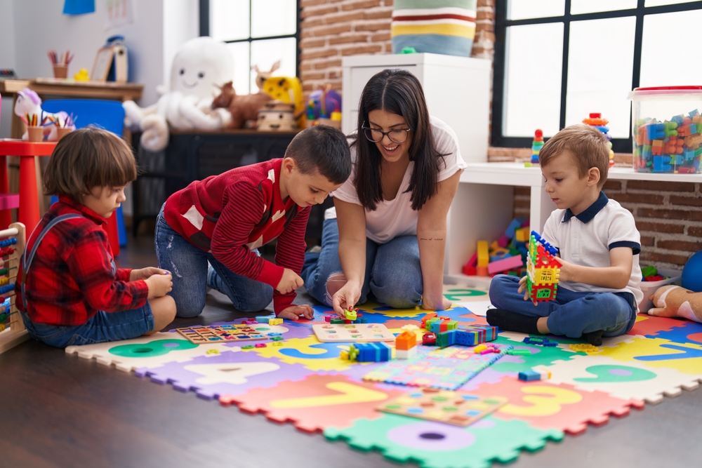 Tutor,With,Group,Of,Boys,Playing,With,Maths,Puzzle,Game